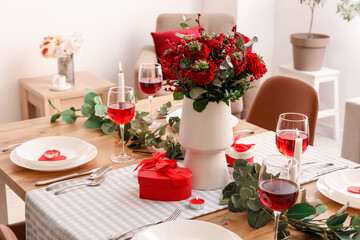 Table setting for Valentine's Day with beautiful flowers in dining room