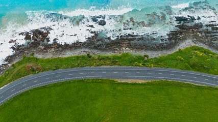 Aerial view  of the Coastal Road, sandy beach and  open sea in summer season Nature recovered Environment and Travel background