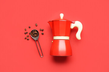 Geyser coffee maker, spoon and beans on red background
