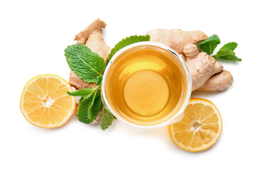 Cup of ginger tea, roots, lemon and mint on white background