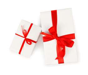 Gift boxes with red satin ribbon isolated on white background. Valentine's Day celebration