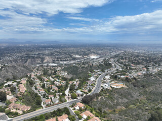 Aerial view over La Jolla Hills with big villas and ocean in the background, San Diego, California, USA