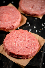 Fresh raw burger on the table. 