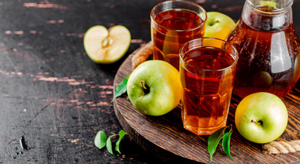 Apple juice on a wooden tray. 
