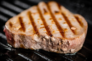 Tuna steak in a grill pan. 