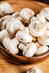 Fresh mushrooms in a wooden bowl. 