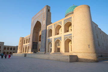Fototapeta na wymiar At the medieval madrasah Miri-Arab on a sunny evening. Bukhara
