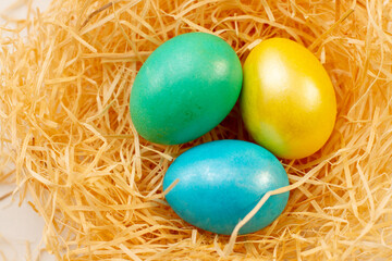 Fototapeta na wymiar colored eggs for easter in a backset