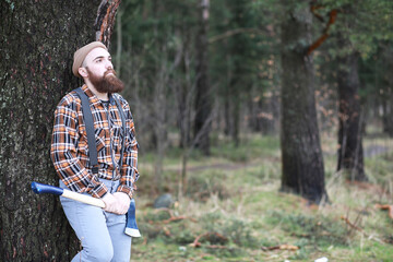 A bearded lumberjack with a large ax