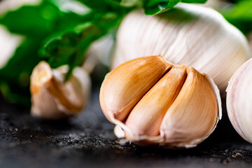 Fragrant garlic with parsley on the table. 