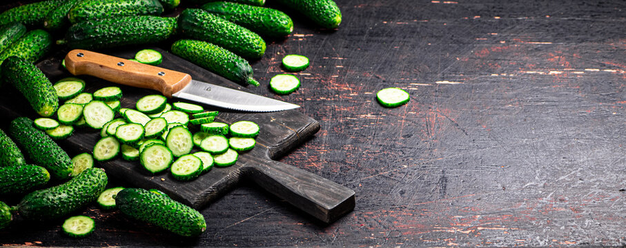 Cucumbers Cut On A Cutting Board. 