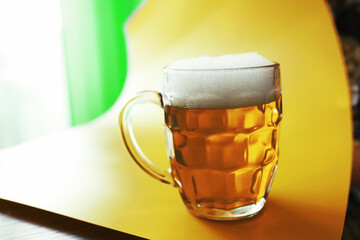 Saint Patrick's Day holiday. National Irish holiday. A mug of golden beer at the bar.