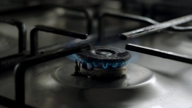 close up view of old gas stove, fire stop to burn. concept of cooking on gas stove in kitchen in morning. Warming up food.