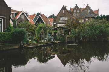 Fototapeta na wymiar Cozy Houses With Balconies In Volendam, Houses Near The Canal In Volendam