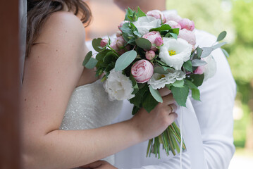 wedding flowers in the hands of the bride and groom. concept for event agencies