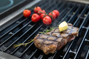 grilled meat with  tomatoes and  rosemary