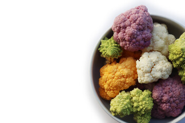 Various sort of cauliflower in a bowl on white background. Purple, yellow, white and green color...