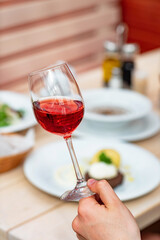  The girl in the restaurant with wine