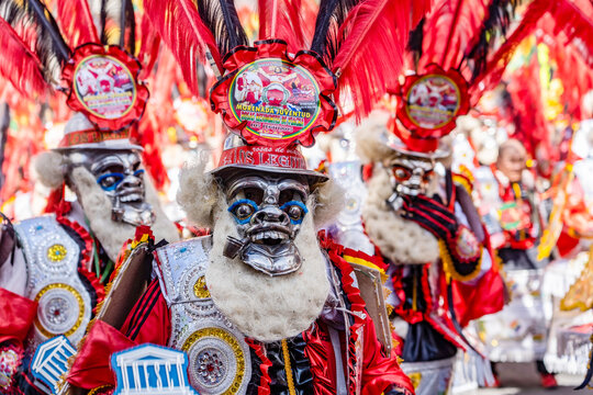 man in red mask at  The festival of the Sant&iacute;sima Trinidad del Se&ntilde;or Jes&uacute;s del Gran Poder in the city of La Paz