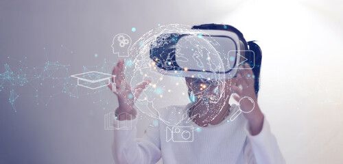 Girl playing with VR glasses. Future technology virtual reality learning media concept.