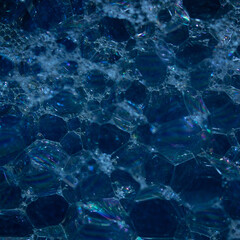 a warm bath in a blue tub ready to be enjoyed. Background decorated with sequins