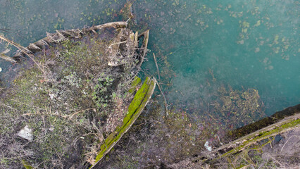 Boat cemetery located in the province of Treviso in Casier. Dead boats in crystal clear water with seagulls and birds that build nests for us to procreate.