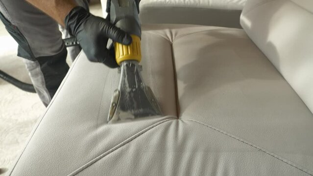 CLOSE UP: Clean upholstered couch surface after deep cleaning with vacuum cleaner. Revealing clean fabric at washing and vacuuming of furniture as a mandatory household chore during spring-cleaning.