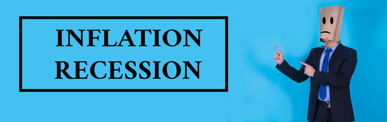 businessman with inflation and recession concept on blue background