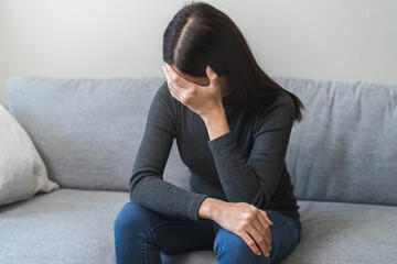 Sad, unhappy. Alone asian young woman, girl hand cover face thinking about problem, difficulty, feeling failure and exhausted, suffering from loneliness, grief sorrow and bad relationship or break up.