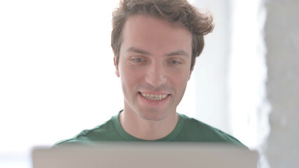 Close Up of Young Man Doing Video Chat on Laptop