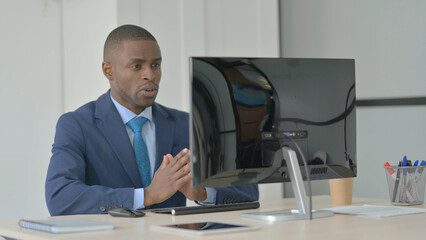 Young African Businessman Talking on Video Call on Computer