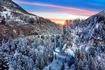 Landwasser Viaduct world heritage in Swiss Alps snow winter scenery, Switzerland.