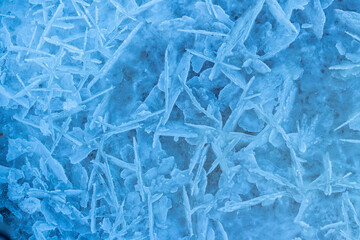 Winter ice surface on Daugava river in Latvia. Ice texture blue background