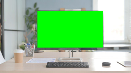 Desktop with Green Screen on Desk in Office