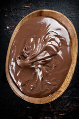 Hazelnut butter in a plate with a spoon. 