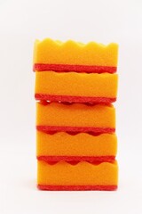 Set of orange sponges for washing dishes