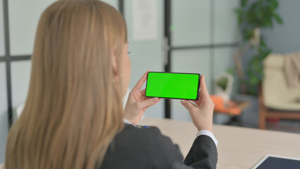 Young Businesswoman Watching Smartphone with Chroma Key
