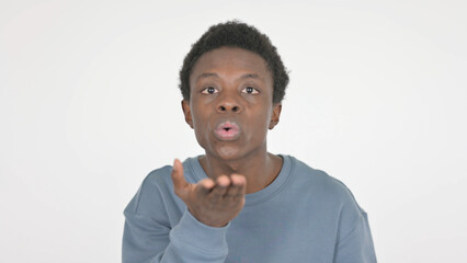 Flying Kiss by Young African Man on White Background