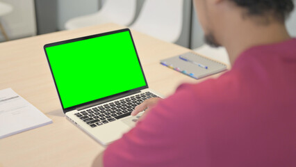 Close up of African Man Using Laptop with Green Screen