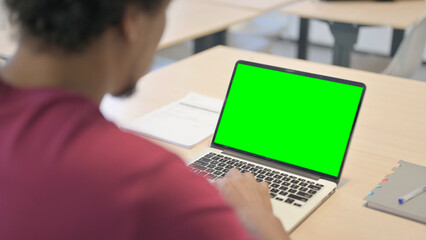 Close up of African Man Working on Laptop with Chroma Key Screen