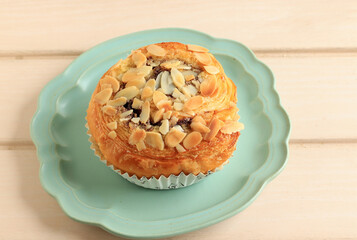 Cinnamon Puff Pastry  Roll with Almond Flake Topping