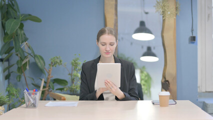 Businesswoman using Digital Tablet, Browsing Internet