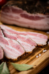 A delicious homemade piece of lard on a cutting board. 