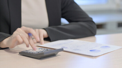 Close up of Businesswoman Calculating Business Data