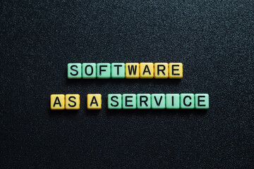 Software as a service - word concept on cubes, text