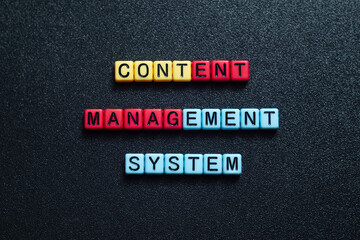 Content management system - word concept on cubes, text