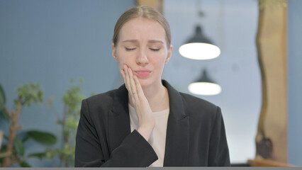 Portrait of Businesswoman having Toothache at Work