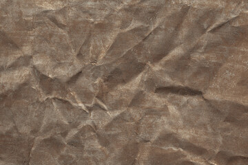 Dark background in colors of old gold and silver. Shiny decorative surface, Christmas. Texture, copy space, design, vintage, retro.