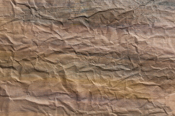 Background in warm and cool tones. Creased, wrinkled paper texture. Design, retro, vintage, grunge.