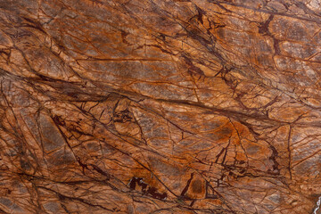 Bidasar Brown. Rainforest Brown Detail slab photo. Light brown marble, chaotic rugged dark brown...